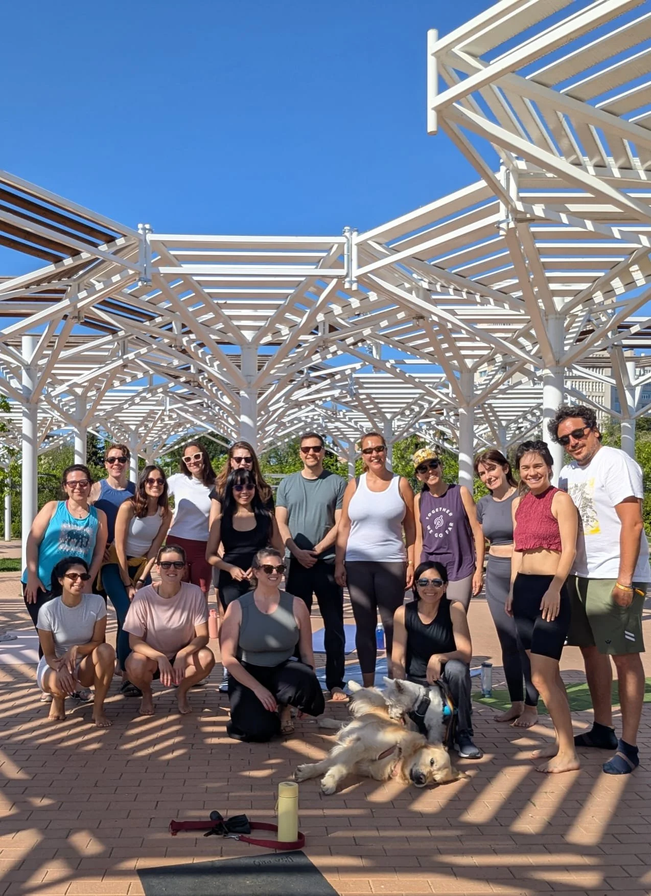 A group of international friends practicing yoga in English in Madrid at Madrid Yoga Collective