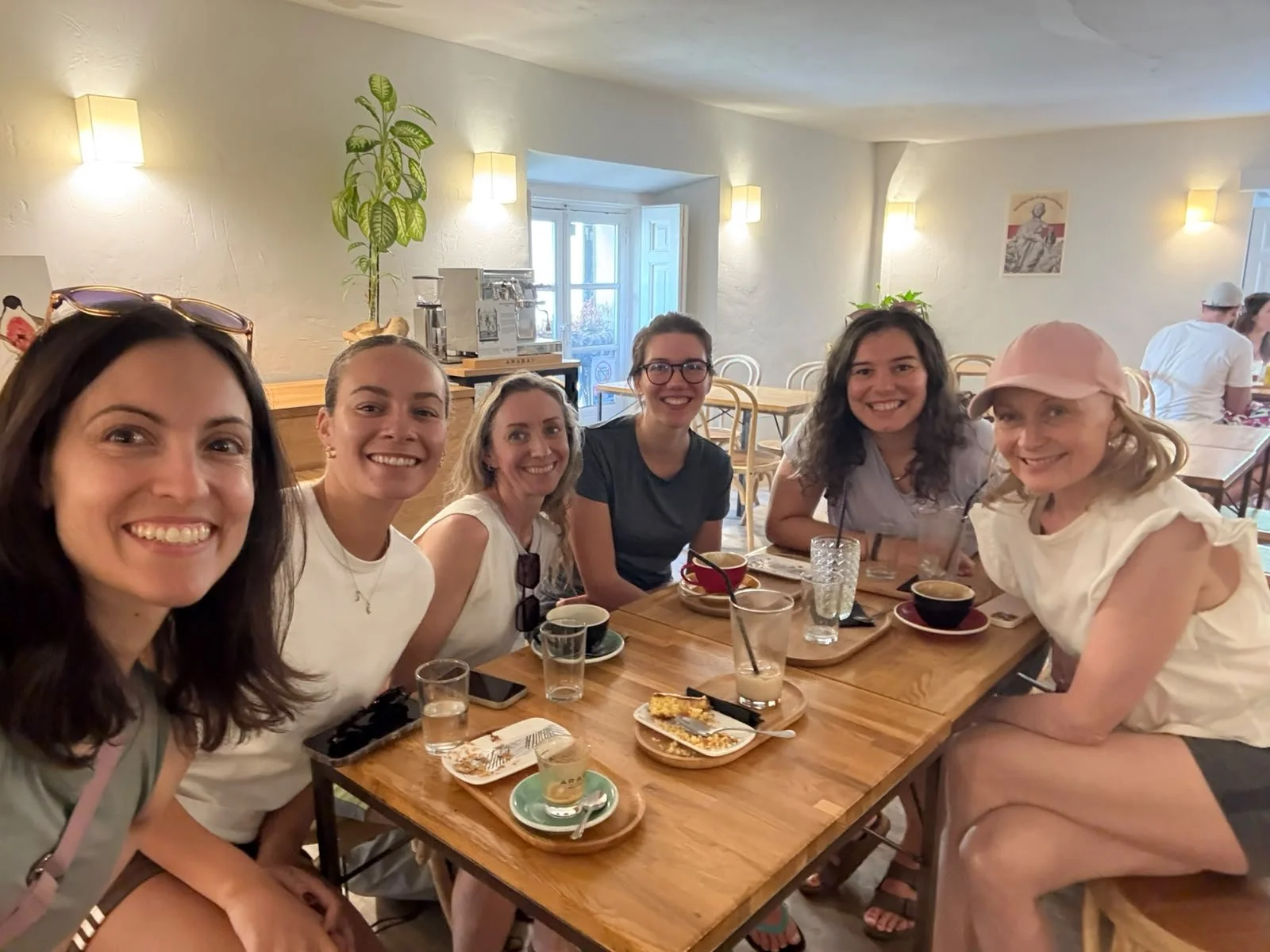 International friends in Madrid enjoy a social occasion after an English yoga class in Madrid