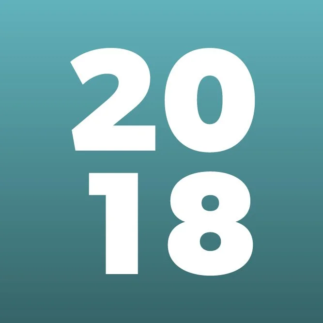 Bold white numbers displaying '2018' on a gradient teal background.