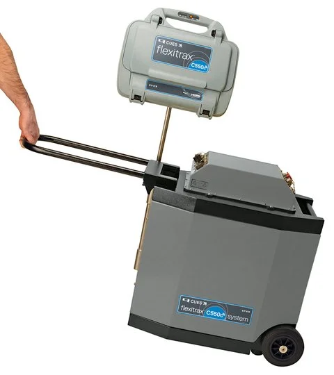 Pearpoint Flextrax portable mainline crawler camera system on a wheeled cart with control case for pipeline inspection.