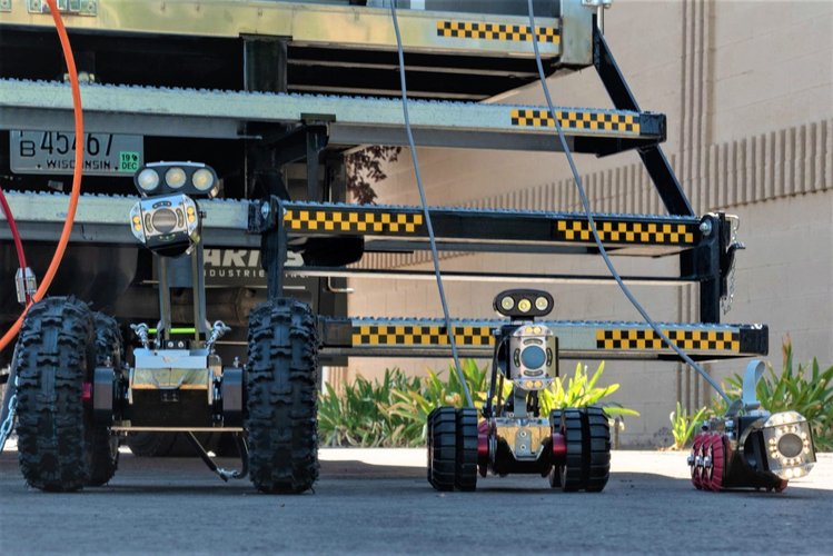 Aries Pathfinder Series self-propelled tractor crawler positioned for inspecting large relined mainlines.