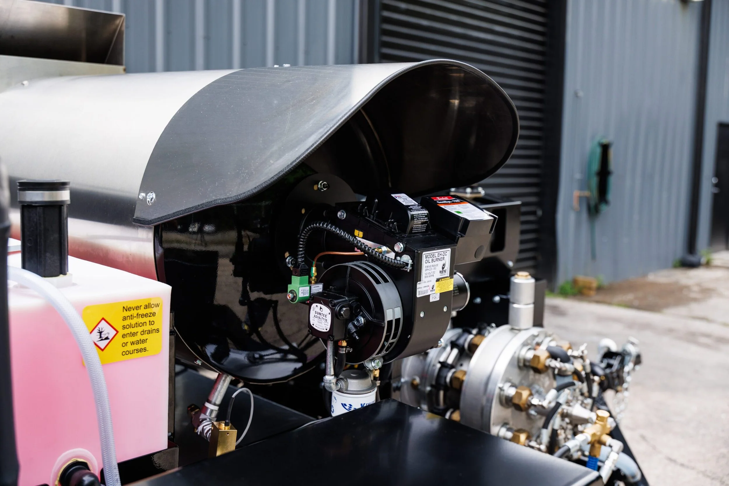 Close-up view of the engine and pump components on a Harben hydro jetting unit.