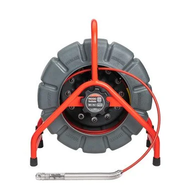RIDGID Mini drain inspection camera reel with push cable and camera head for compact drain lines.