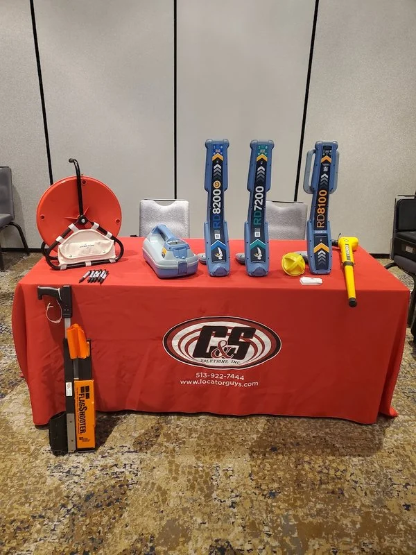 C&S Solutions display table with Radiodetection RD8200, RD7200, and RD8100 utility locators and locating rod equipment.