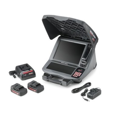 RIDGID SeeSnake CS12x digital reporting monitor shown with dual battery packs and charging accessories.
