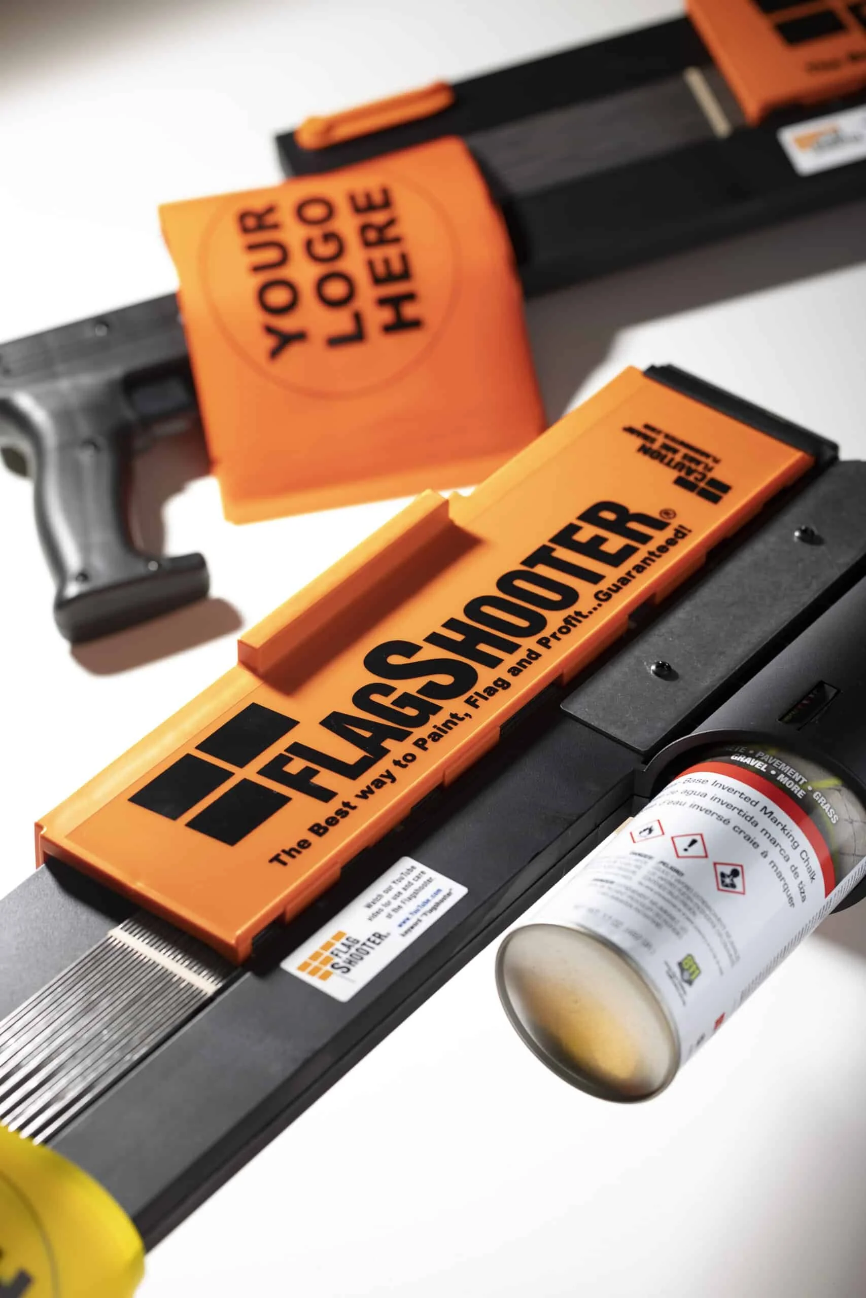 FlagShooter marking gun with a custom logo flag and inverted marking paint can used for utility locate marking.