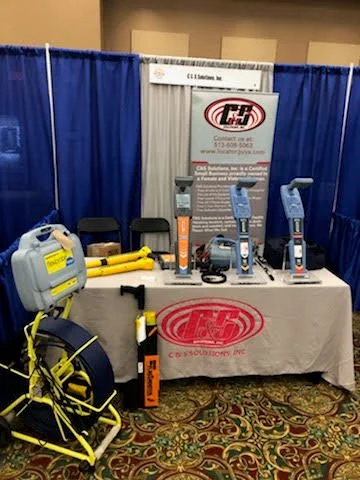 C&S Solutions trade show booth display featuring utility locating equipment, locators, and inspection reels.