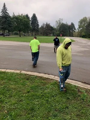 technician-walking-barn-locating-equipment