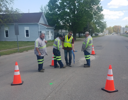 Utility workers gathered around cones during Radiodetection RD8100 utility locator training.