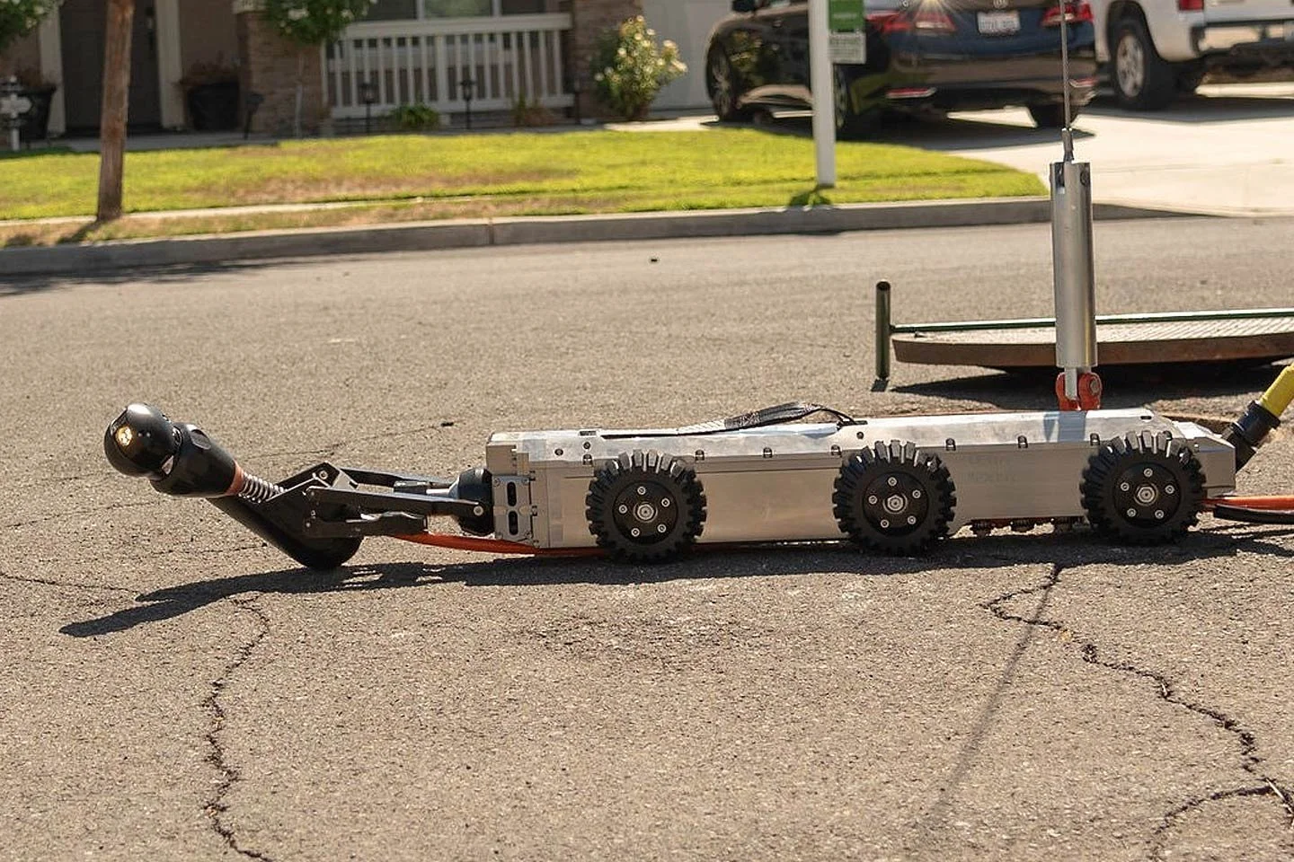 LETS 6.0 lateral inspection crawler sitting on a residential roadway before deployment.
