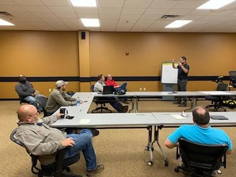 Instructor leading a classroom-based PCM locator training session with the City of Jackson, Tennessee.