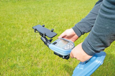 Close-up of the Radiodetection PCMX detachable foot attachment being used on grass.