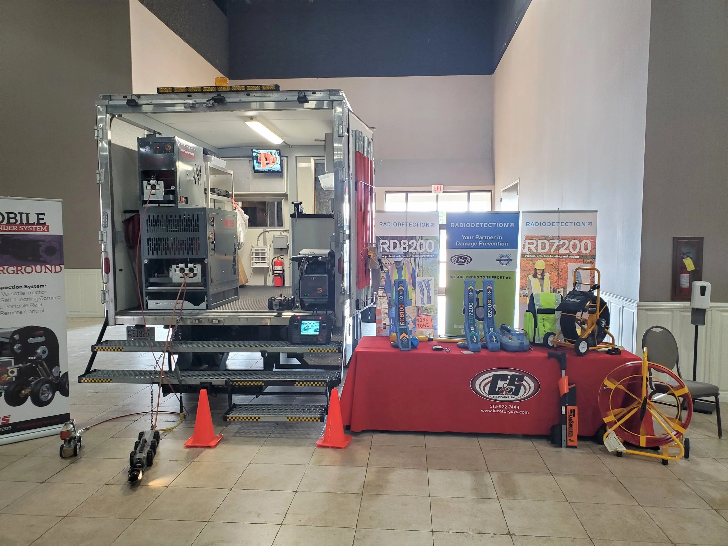 Aries 150,000 rig equipment on display at a trade show booth with inspection systems and signage.