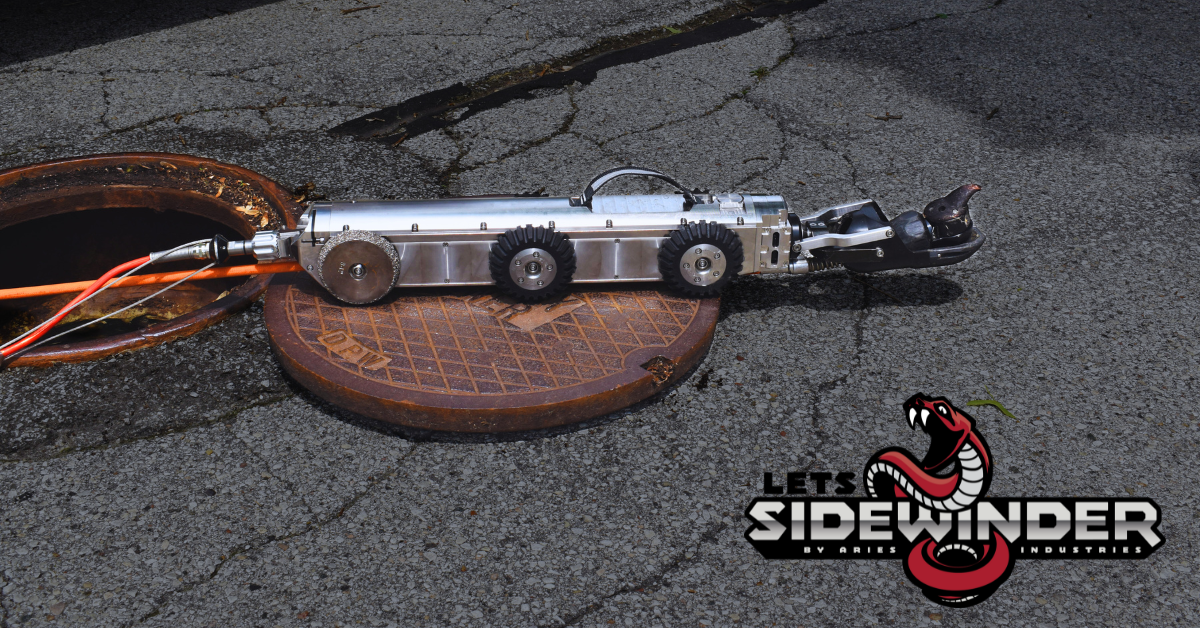 LETS Sidewinder lateral inspection crawler positioned on a manhole cover for pipeline lateral inspections.