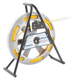 FlexiTrace reel holding small diameter rod, energized by a Radiodetection transmitter for locating small pipes.