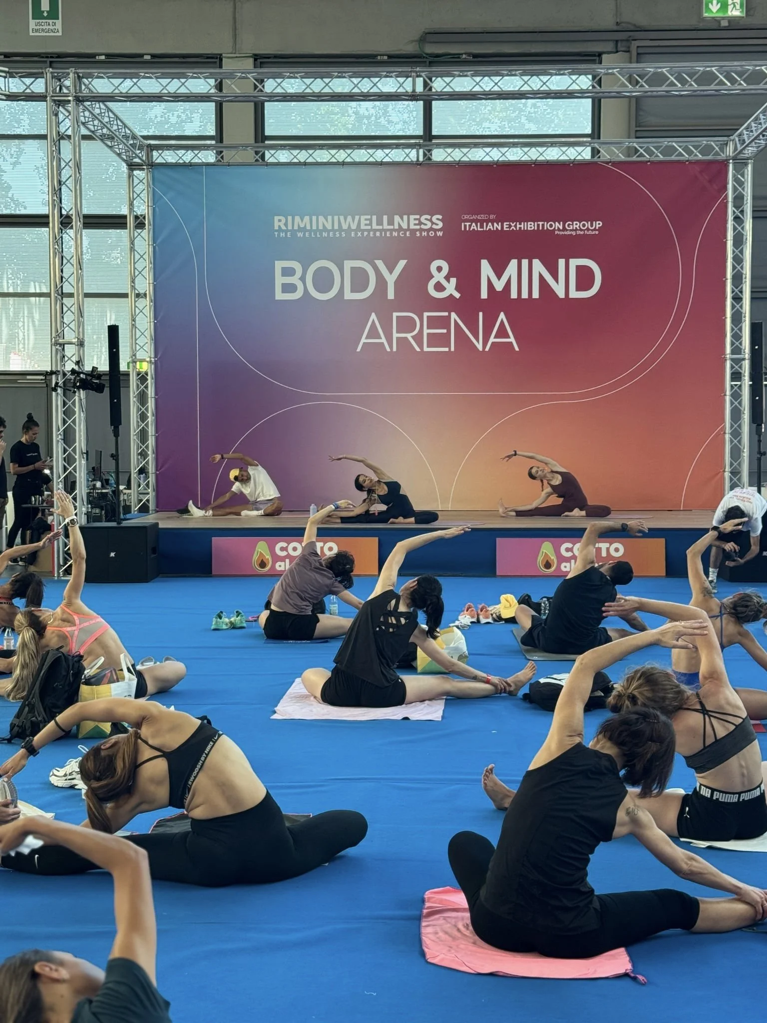 Vittoria Santoliquido leading a Yoga session for Cotto al Dente at RiminiWellness 2025