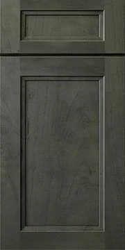 Close-up of a gray wooden door with decorative rectangular panels.