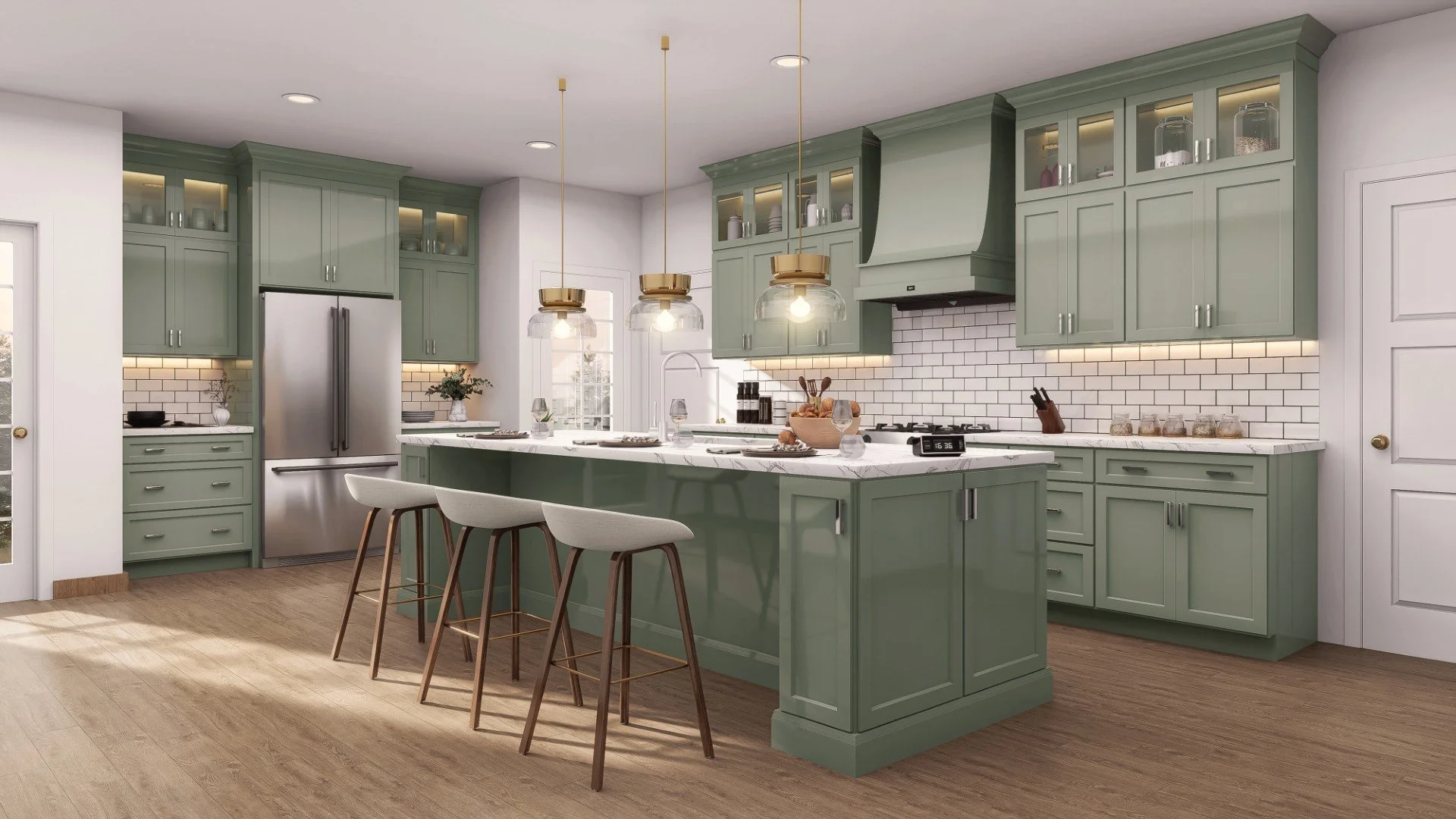 Modern kitchen with green cabinets, white marble island, white subway tile backsplash, pendant lights, stainless steel refrigerator, and wooden barstools.