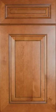 Close-up of a wooden cabinet door with decorative molding.
