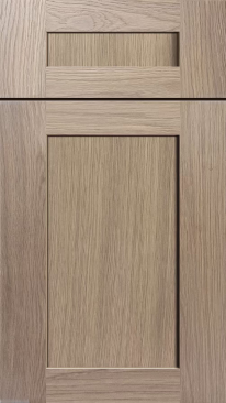 Close-up of a light wood cabinet door with a small rectangular handle cutout at the top.
