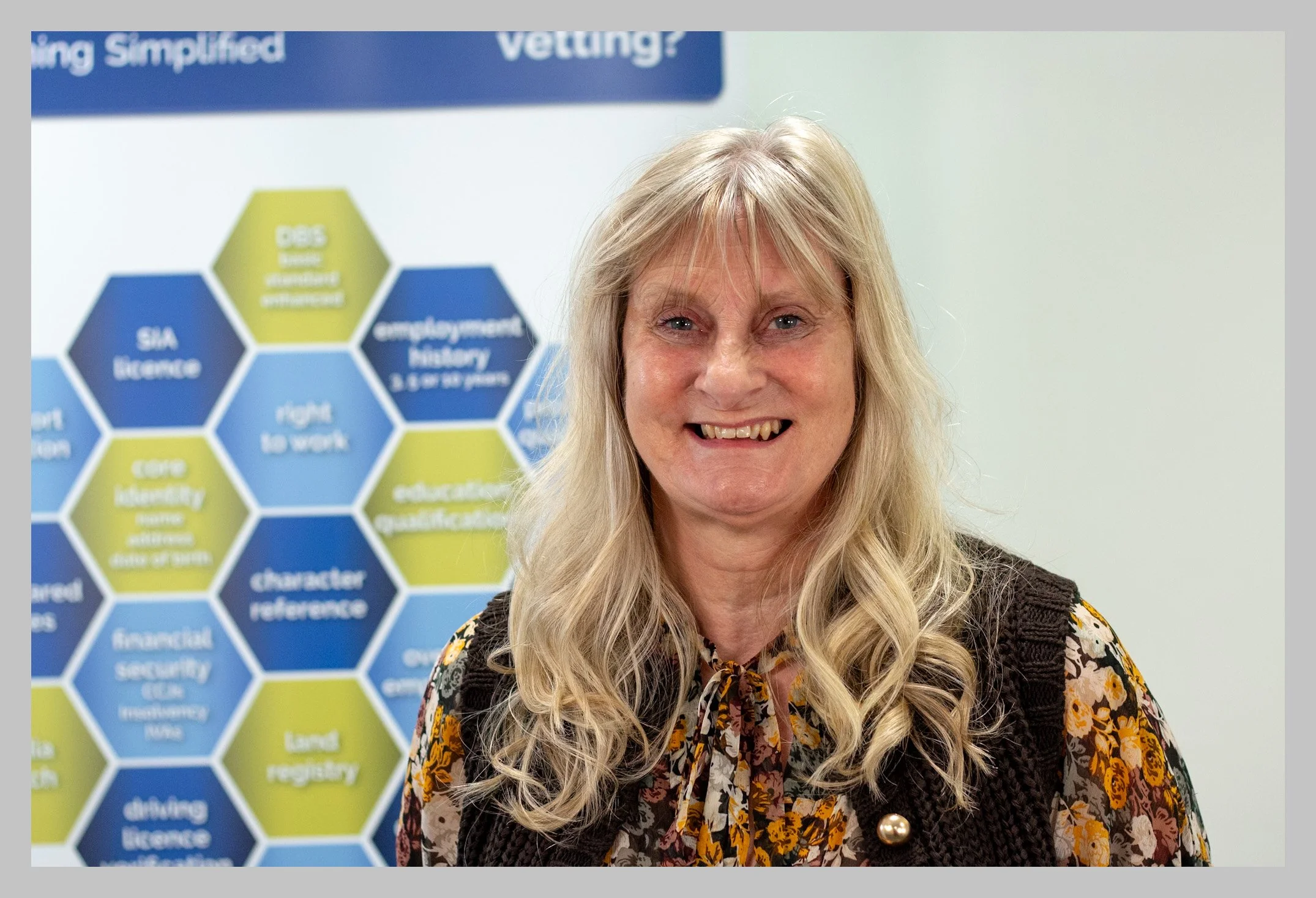 Janet beside poster with border.jpg