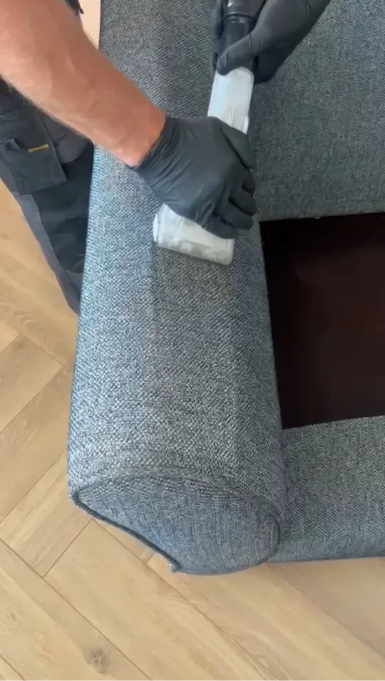 couch arm being cleaned