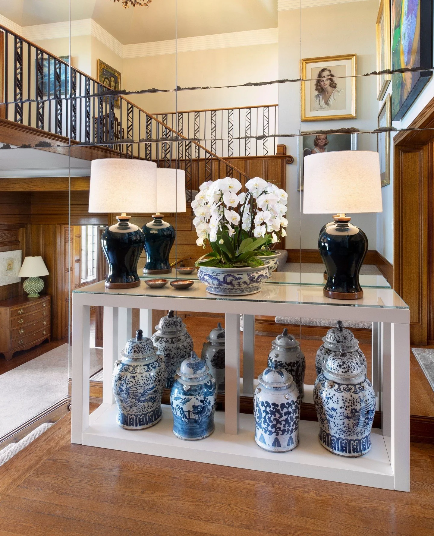 ⁠
We love working with our clients collections to breath in new life yet retain the joy each piece carries. This landing and entry to the living area was transformed using an existing console lacquered in crisp white. Perfect to showcase the deep blu