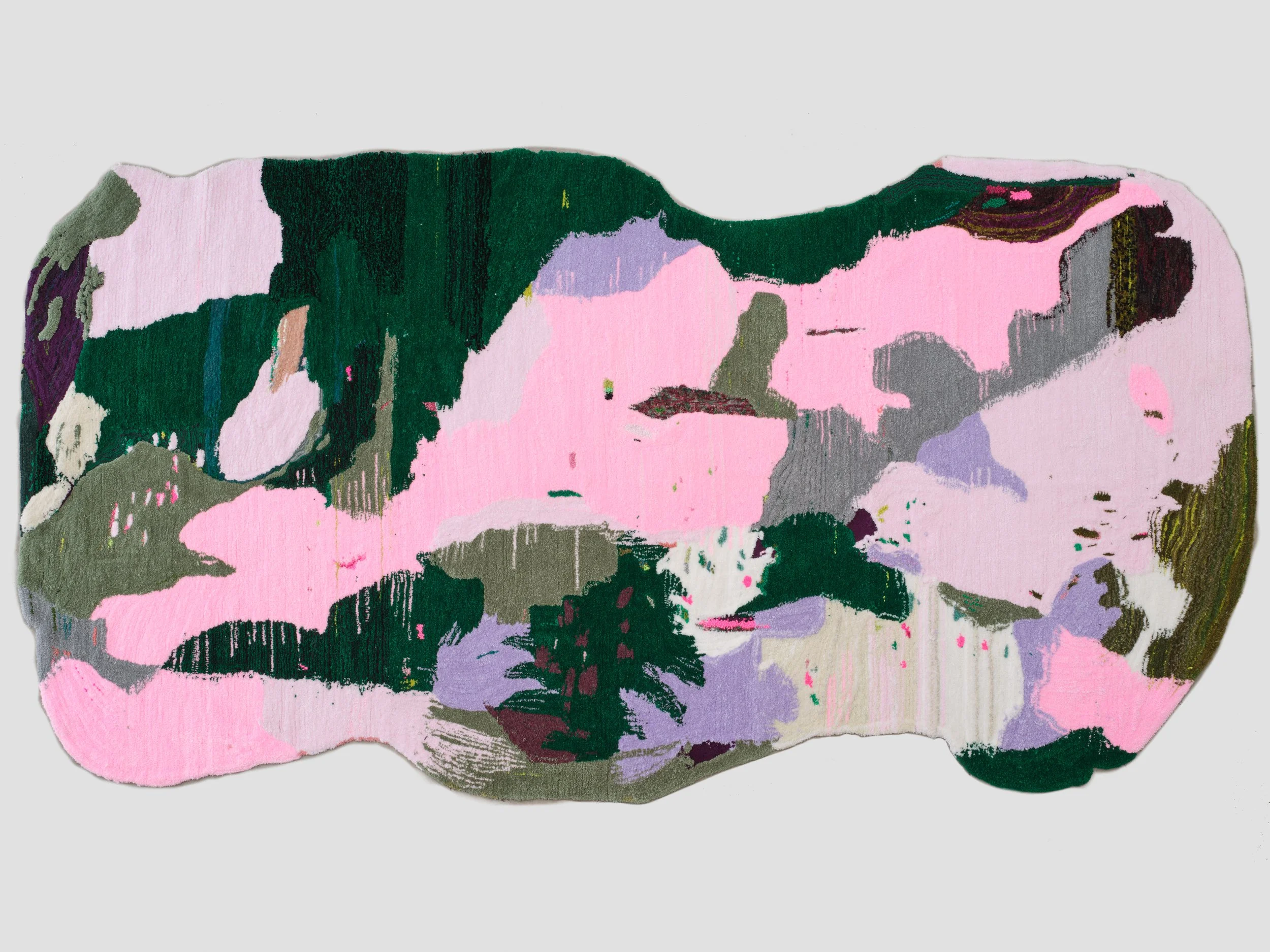 Abstract colorful rug with dominant pink, green, gray, and purple hues.