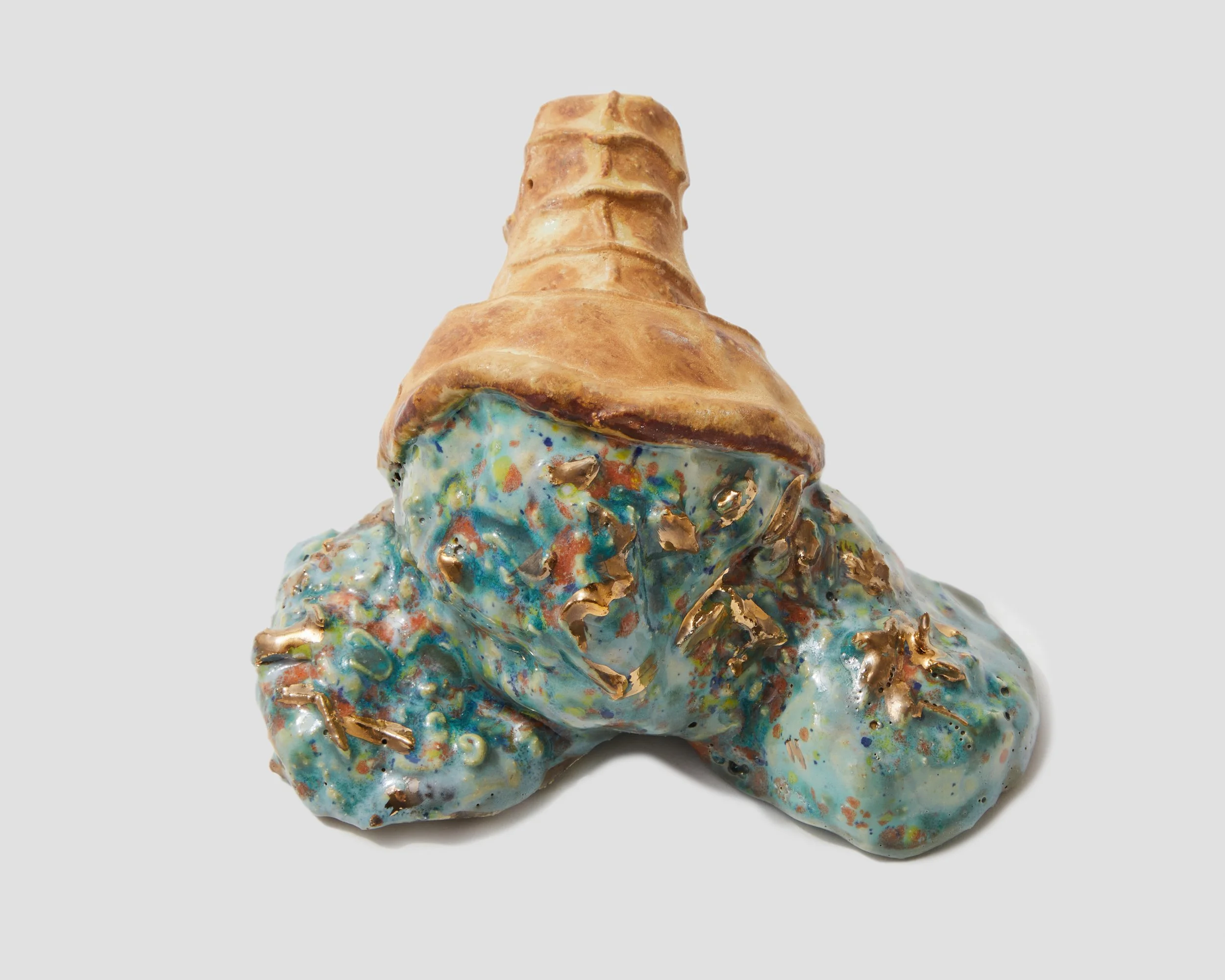 An icecream with colorful, abstract painted patterns and gold accents, placed on a plain light gray background.