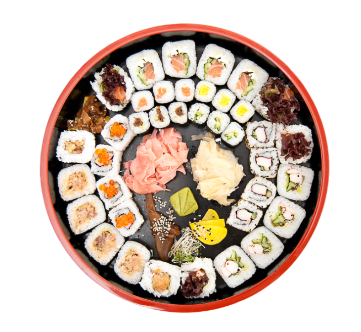 Round sushi platter with assorted sushi rolls, ginger, wasabi, and soy sauce.