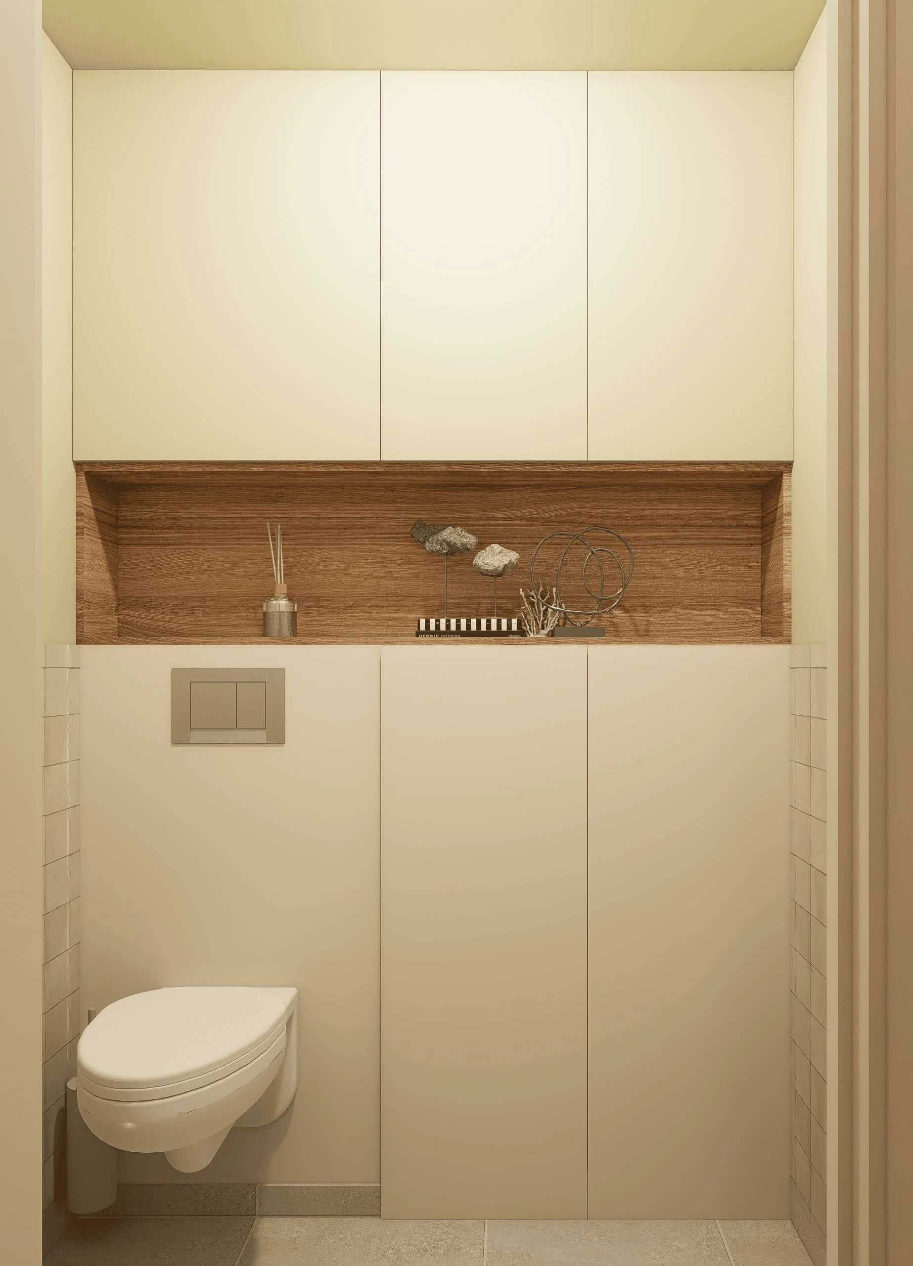 Le WC devient un espace fonctionnel grâce à un mobilier toute hauteur qui dissimule les rangements du quotidien tout en mettant en valeur une niche décorative en bois.