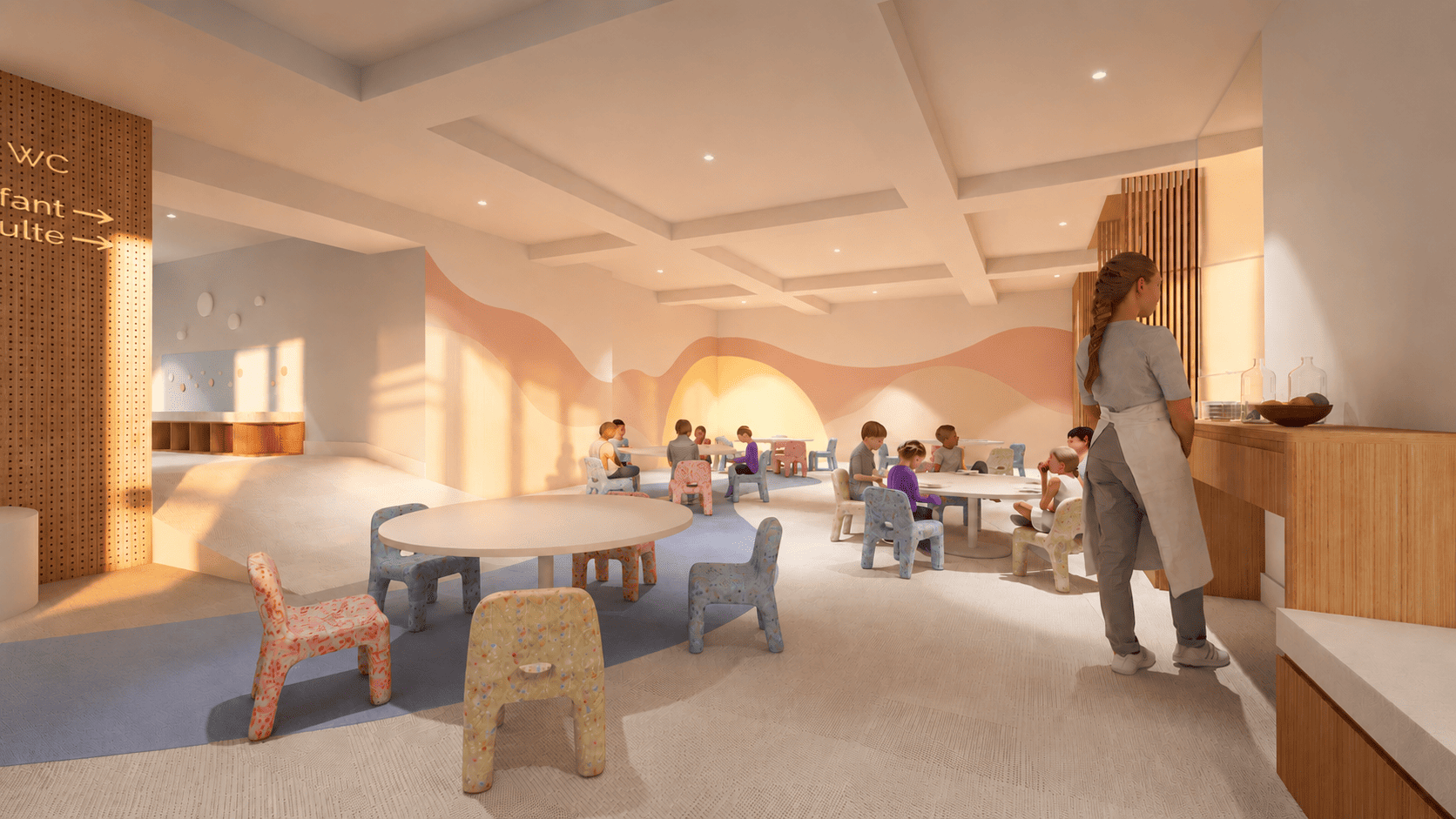 Un espace modulable accueillant les ateliers en journée et les repas des enfants en soirée.