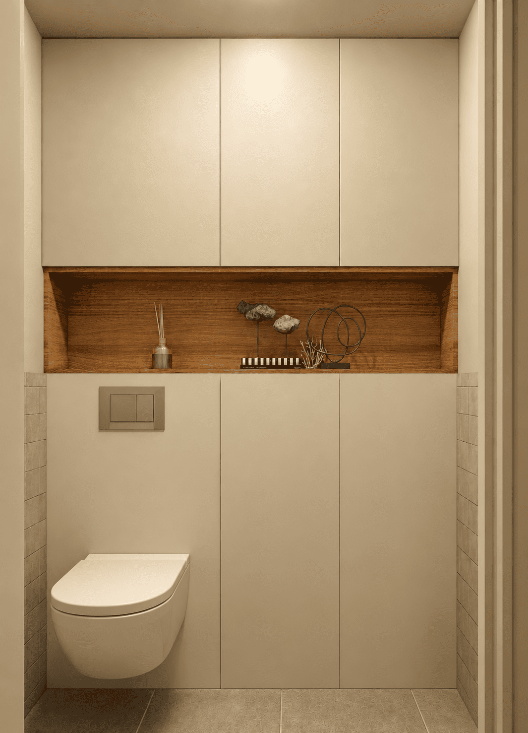 Le WC devient un espace fonctionnel grâce à un mobilier toute hauteur qui dissimule les rangements du quotidien tout en mettant en valeur une niche décorative en bois.