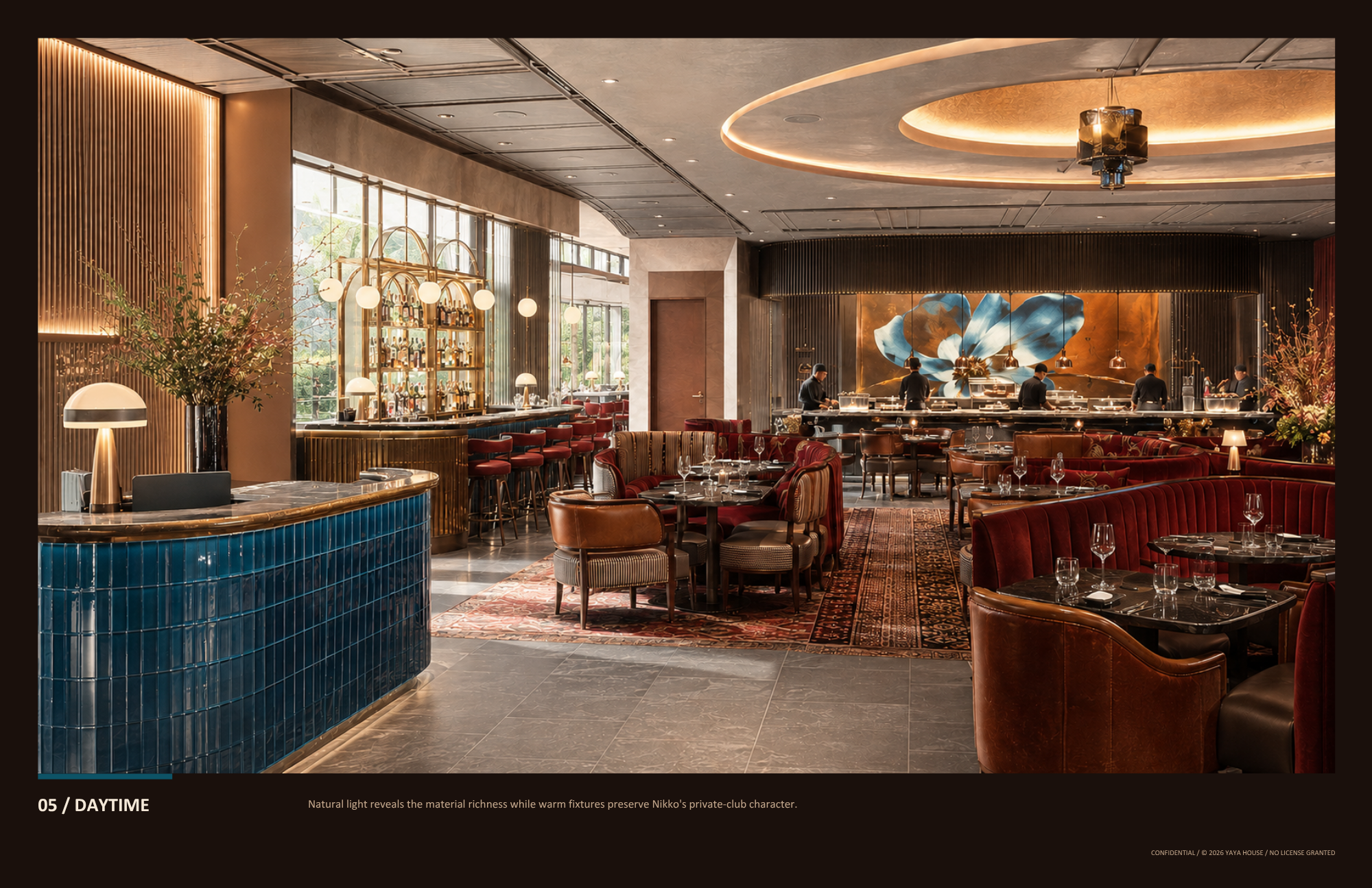 Elegant restaurant interior with a bar area featuring blue tile counter and red bar stools, tables set with glassware, and a kitchen with chefs working under warm lighting. Large windows let in natural light, highlighting the luxurious decor and artw