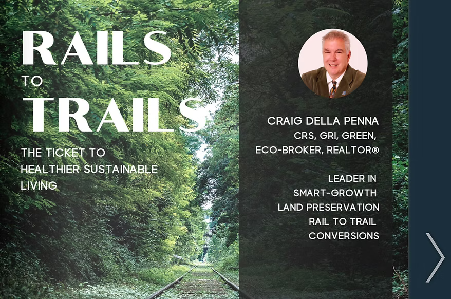 A presentation slide promoting sustainable living through rail transportation. The slide features a lush green forest background with train tracks and a photo of Craig Della Penna, a real estate broker and leader in land preservation and rail-to-trail conversions. The slide contains the text: "Rails to Trails, the ticket to healthier sustainable living," and details Craig Della Penna's credentials and initiatives.