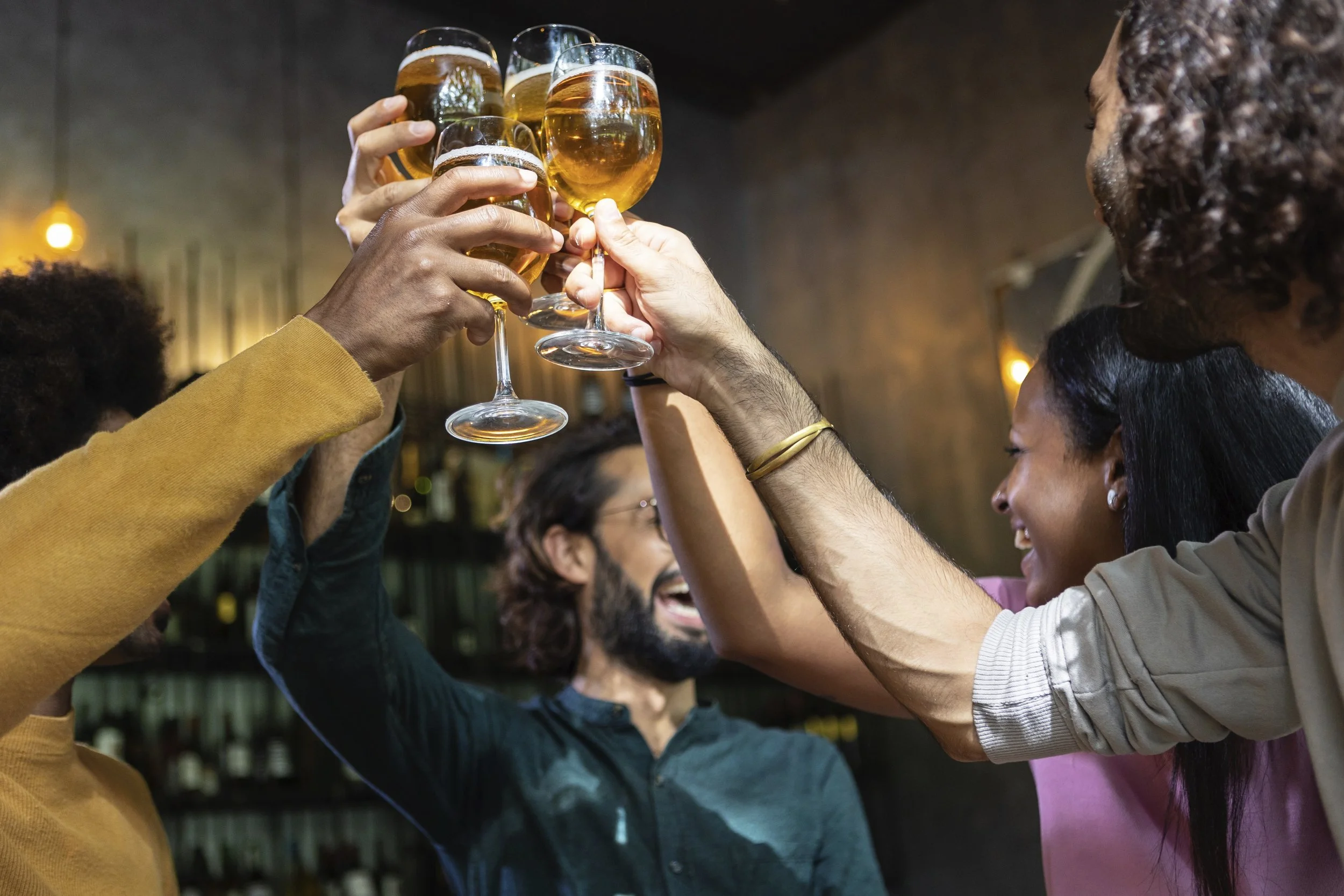 young-group-of-multiracial-people-toasting-cold-be-2026-03-20-06-08-49-utc.jpg