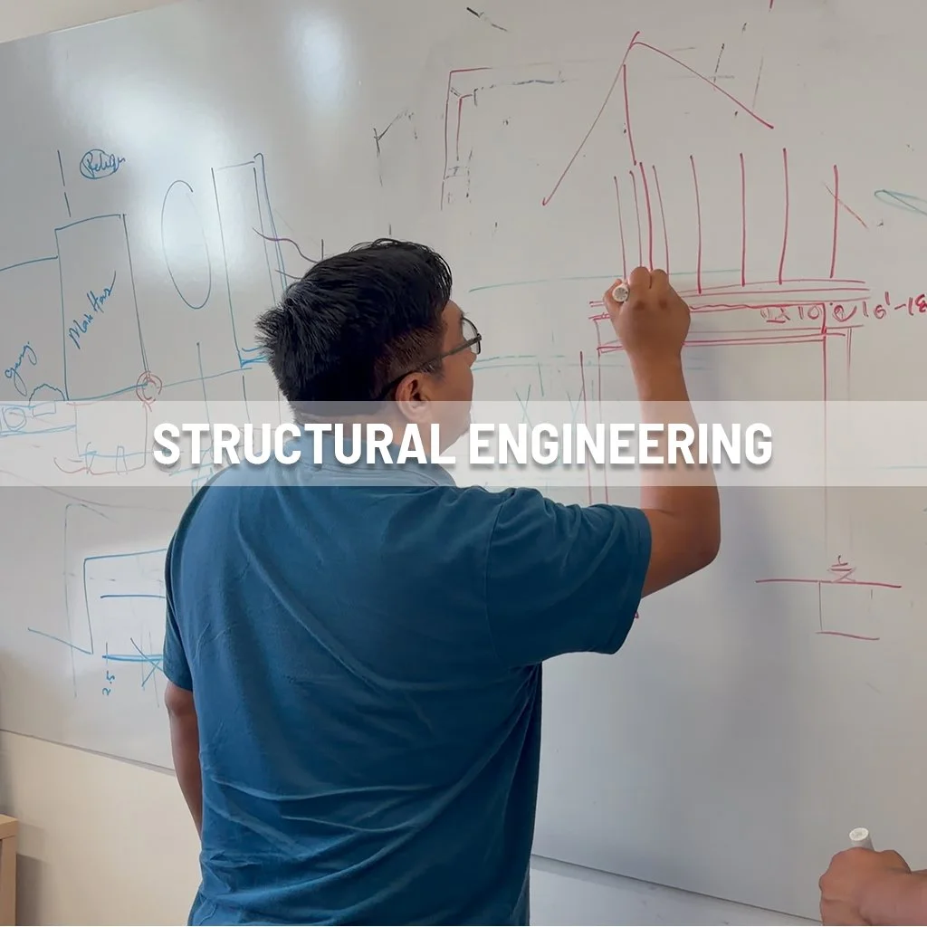 Structural engineering drawing diagrams on a whiteboard