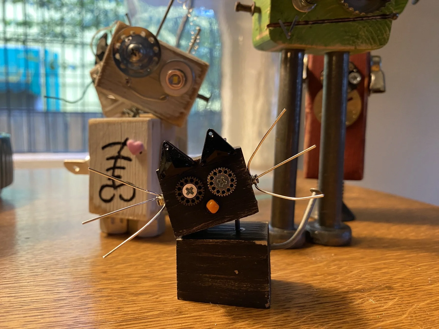 Upcycled steampunk cat sculpture made from found hardware