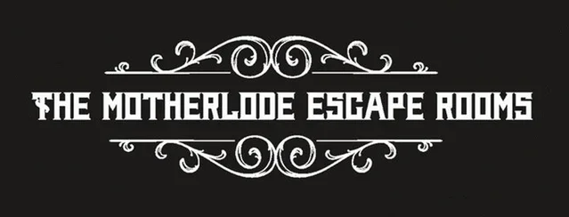Logo for The Motherlode Escape Rooms with decorative swirl elements on a black background.