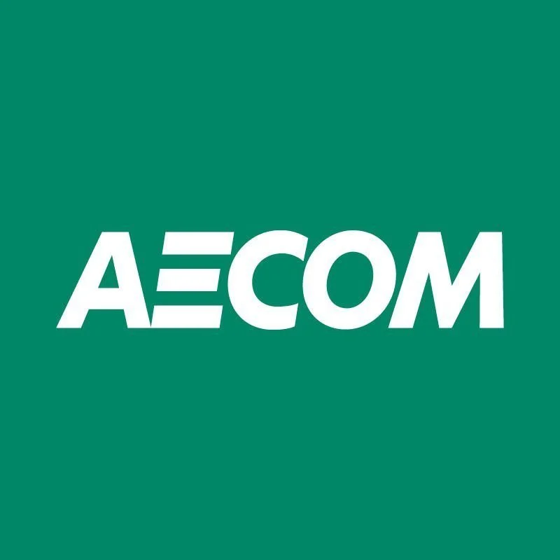 A logo with the text 'AE COM' in white on a teal background.