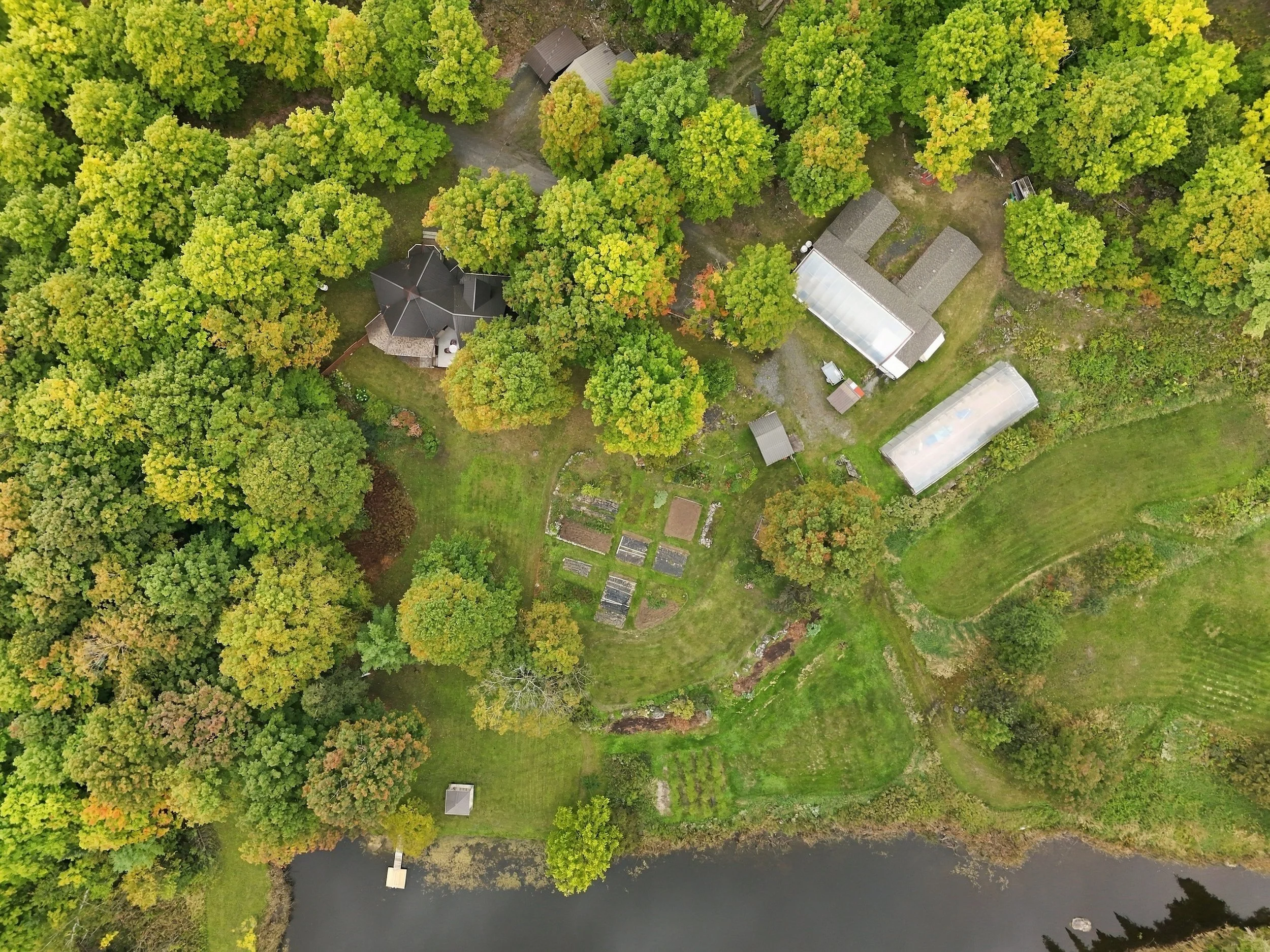 Aerial drone photo of a river through green countryside near Ottawa, real estate drone photography by NewGlimpse