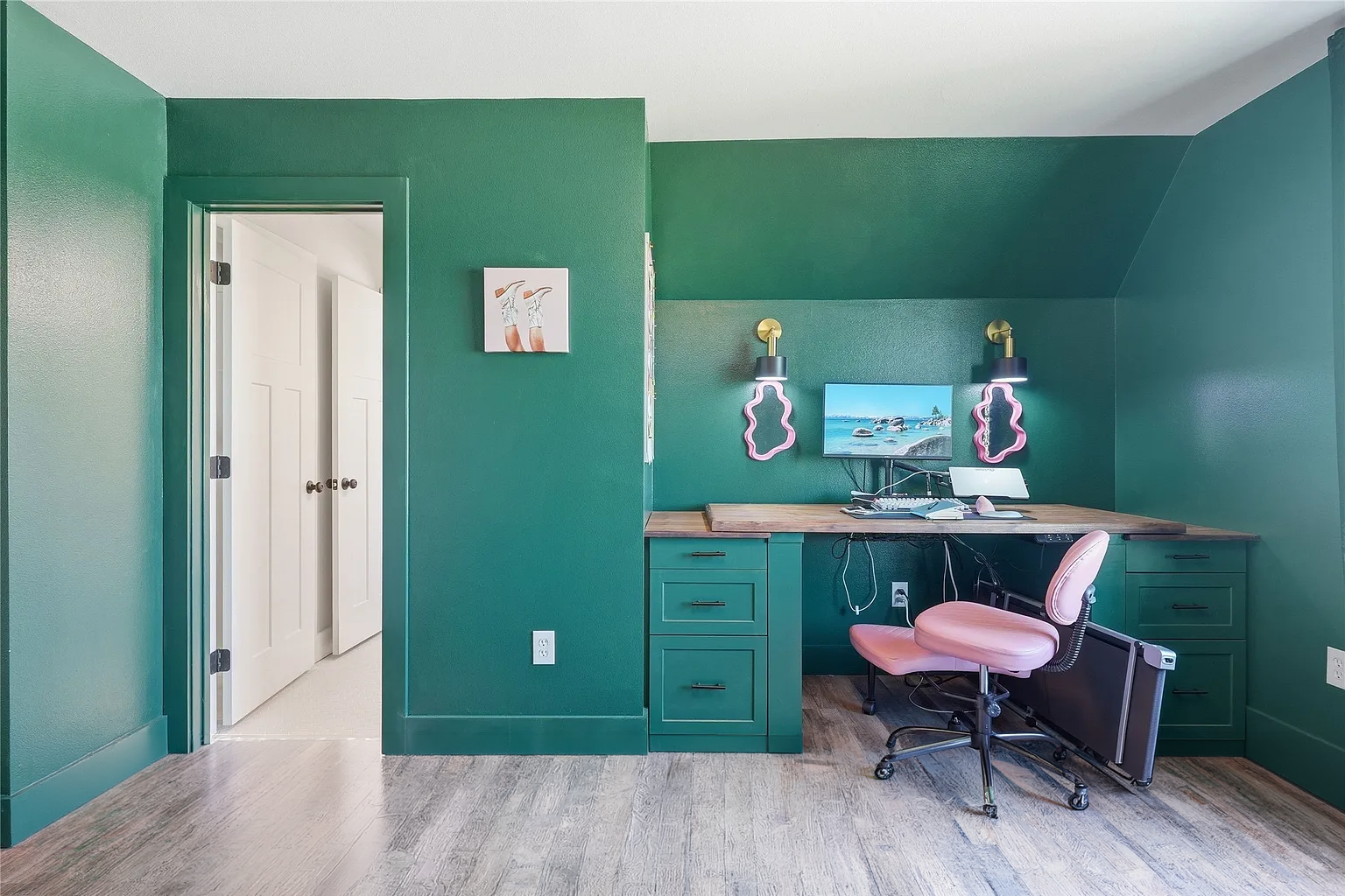 Client requested Green and Pink theme. Across one wall, cabinetry stretches from one side to the other, Moving from bookshelf to reading nook. 1.5" thick walnut tops. 

Along the opposite wall, A standing desk is carefully concealed inside hollow leg