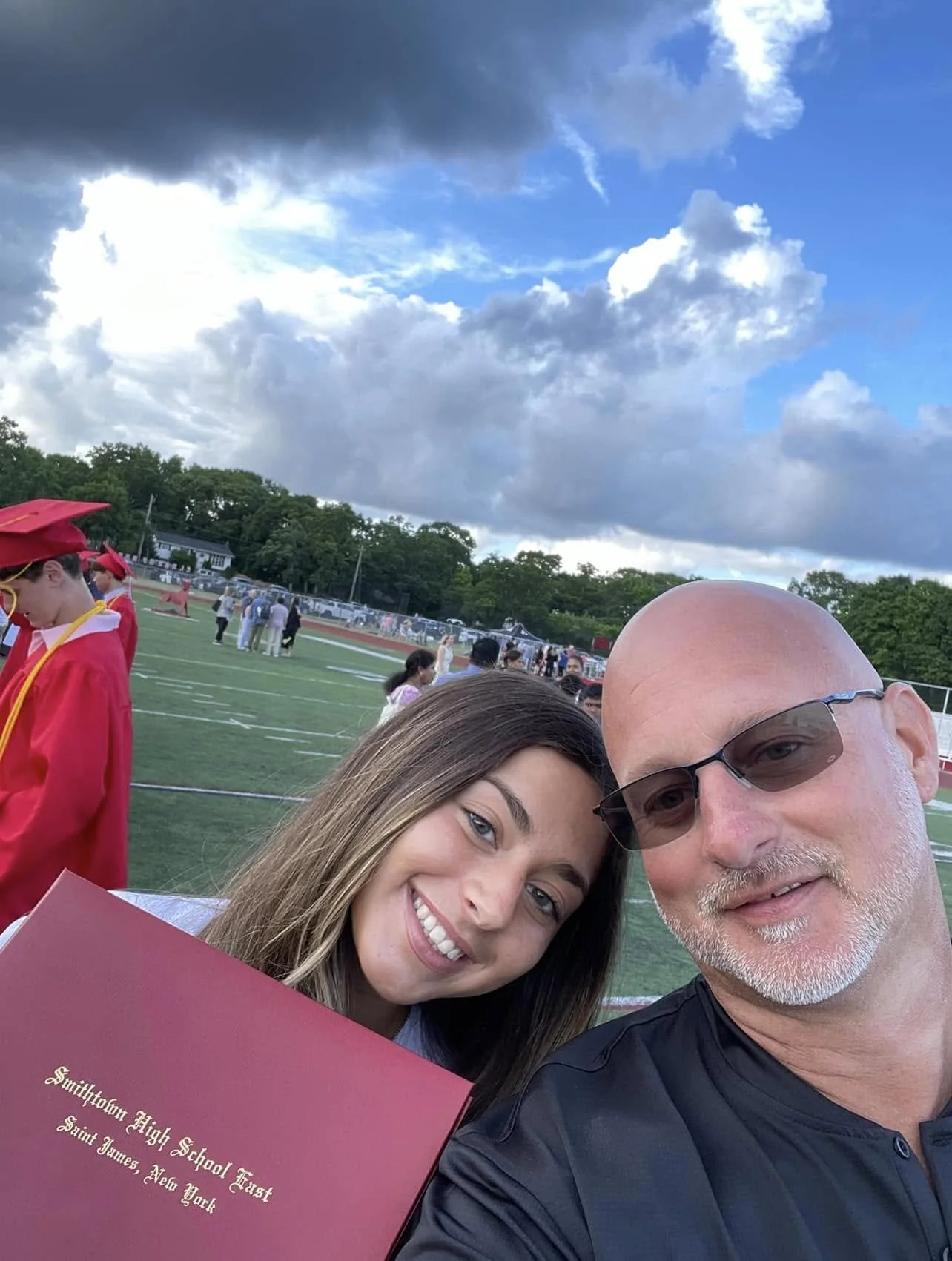 Brian Martinsen with his daughter at her graduation, July 2022