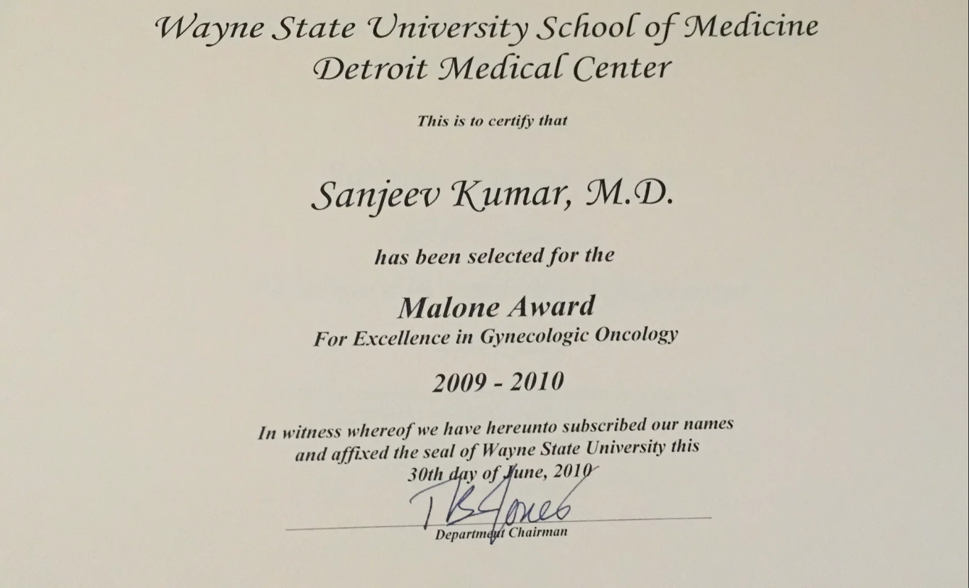 Certificate from Wayne State University School of Medicine Detroit Medical Center awarded to Sanjeev Kumar, M.D., for the Malone Award for Excellence in Gynecologic Oncology, 2009-2010, signed by the Department Chairman.