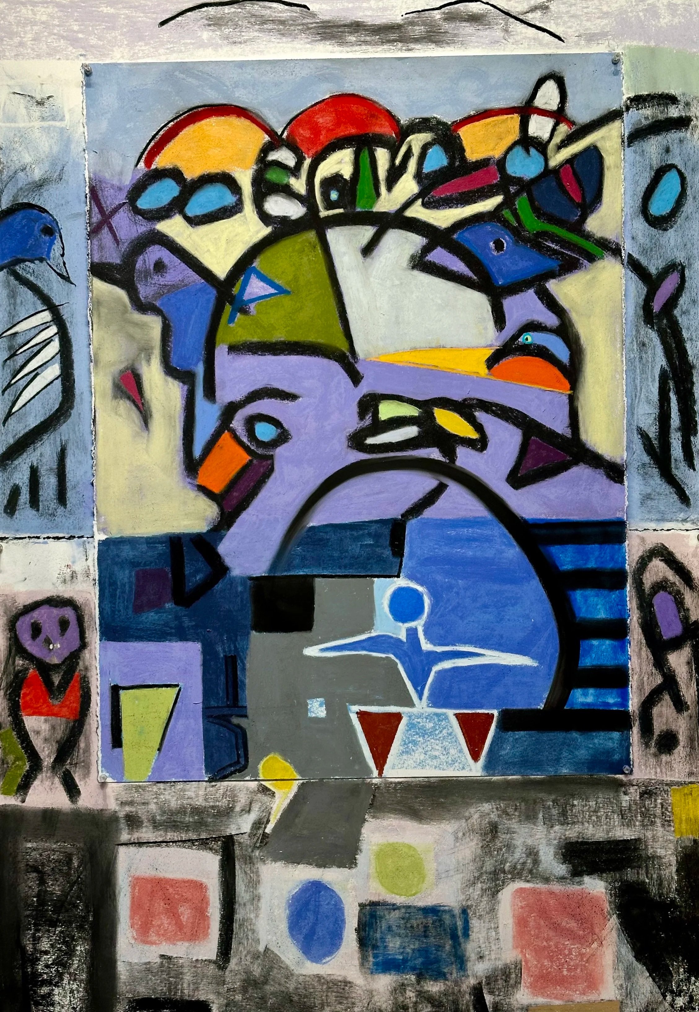 A colorful abstract painting with bold black outlines depicting various shapes and figures, including faces, animals, and geometric forms, in a cubist style.