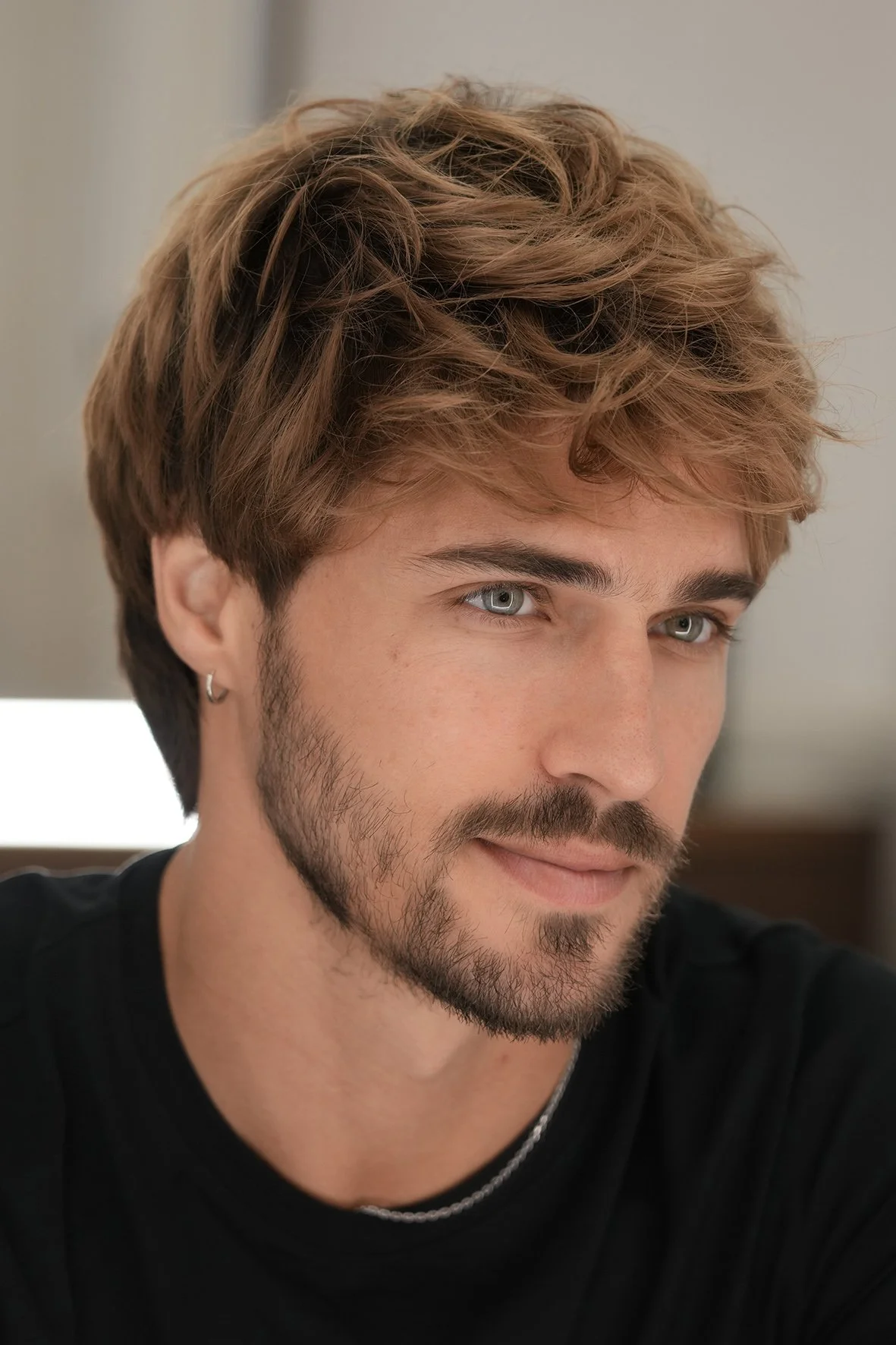 soft texture gent's haircut, with natural sun kissed coloured highlights by Milad.