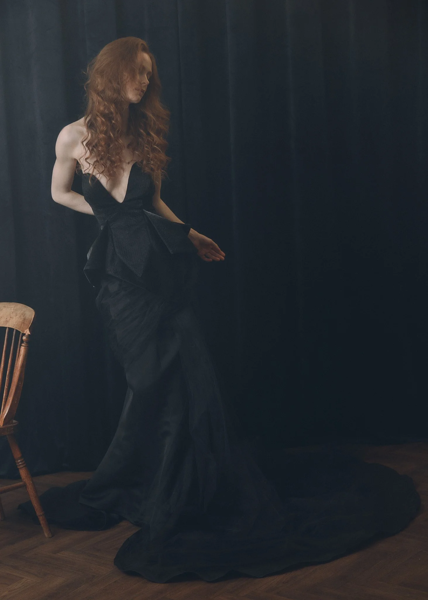 A woman with long red soft wavy hair style by Domenico Sansone at The Six, Mayfair.