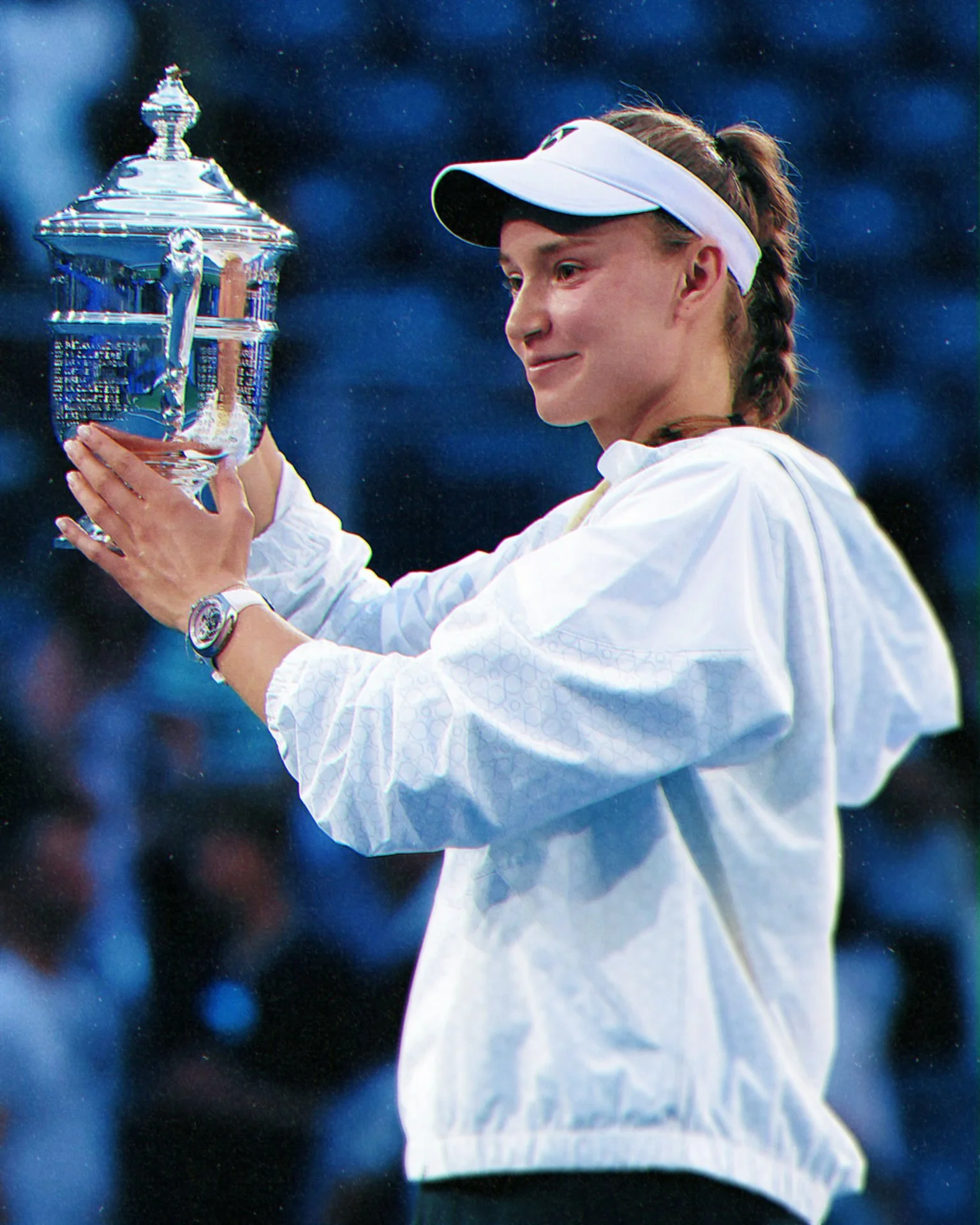 Elena Rybakina holding the trophy with both hands, celebrating her victory of the US OPEN tennis in New York.