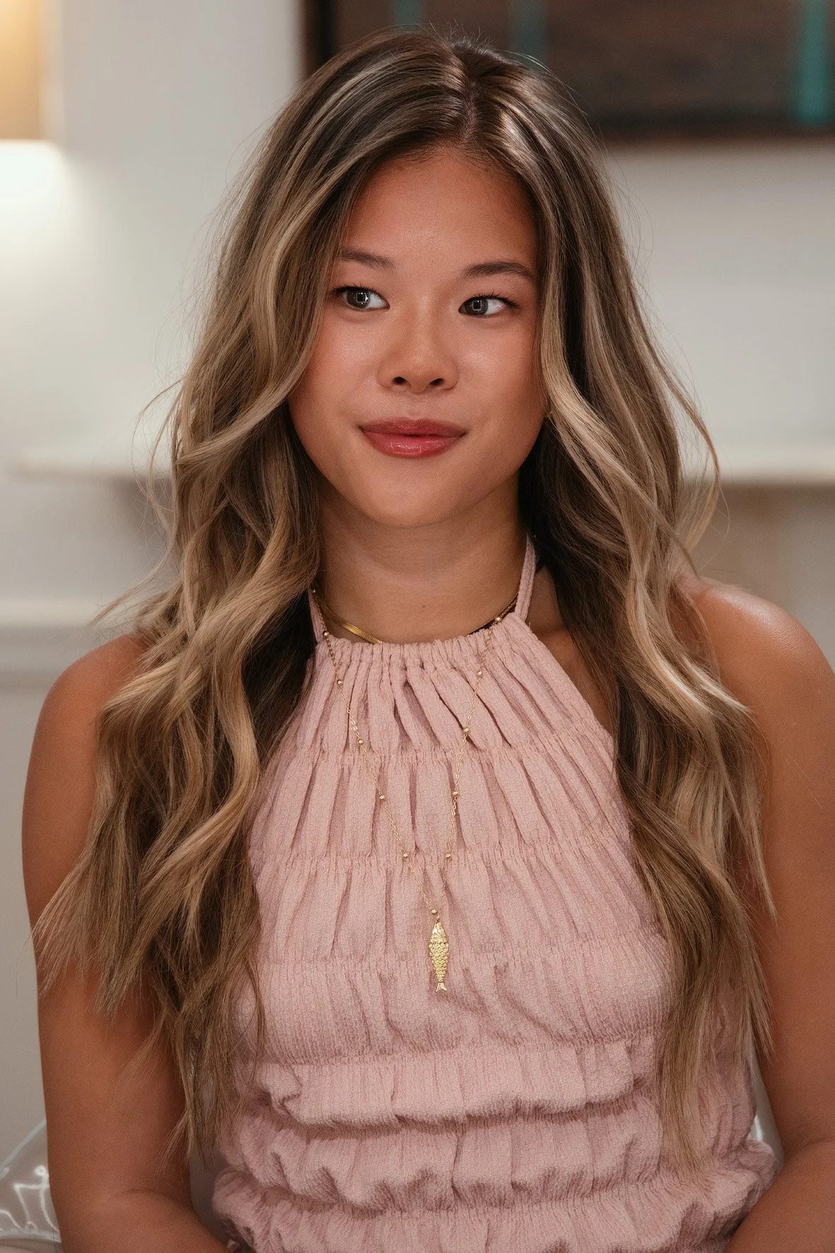 Lived-in blonde colour with face framing and soft beach waves by Nana Howe.