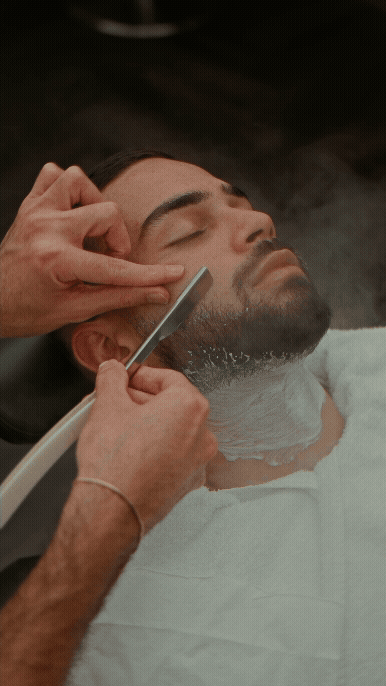 Man receiving a bear shaving and shaping treatment.